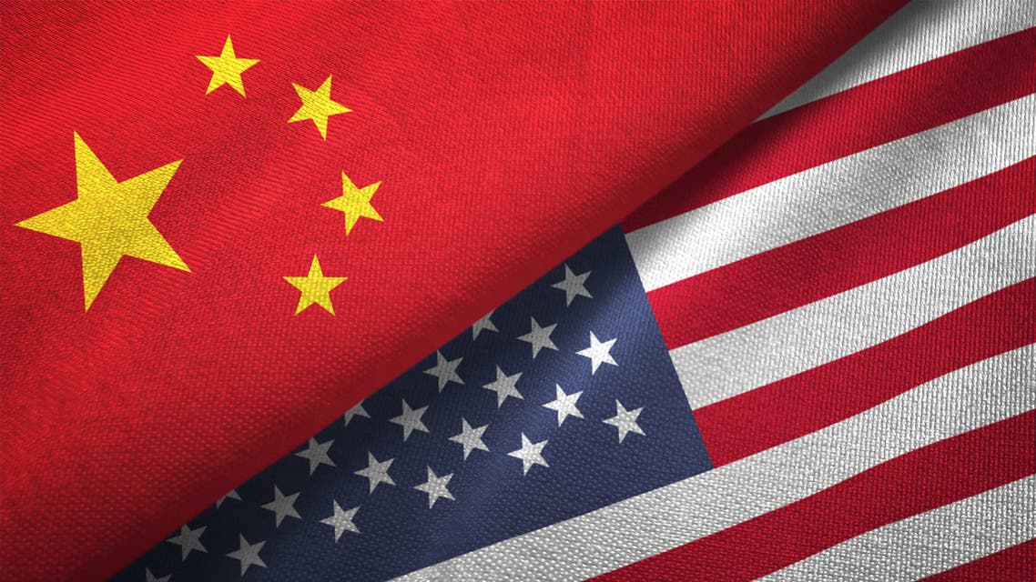 American and Chinese flags on crumpled paper, diplomatic crisis stock photo