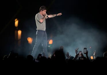 Fans wave to Liam Payne as he performs at the King Abdullah Sports Stadium, in Jeddah, Saudi Arabia, during the concert of Jeddah World Fest, late Thursday, July 18, 2019.  (AP)