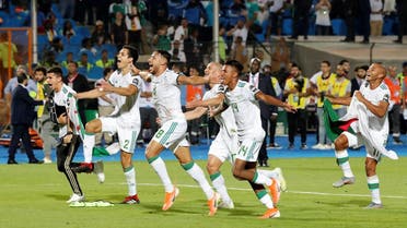 Algeria’s Youcef Belaili with team mates celebrate in front of their fans after winning the Africa Cup of Nations against Senegal at the Cairo International Stadium, Egypt, on July 19, 2019. (Reuters) 