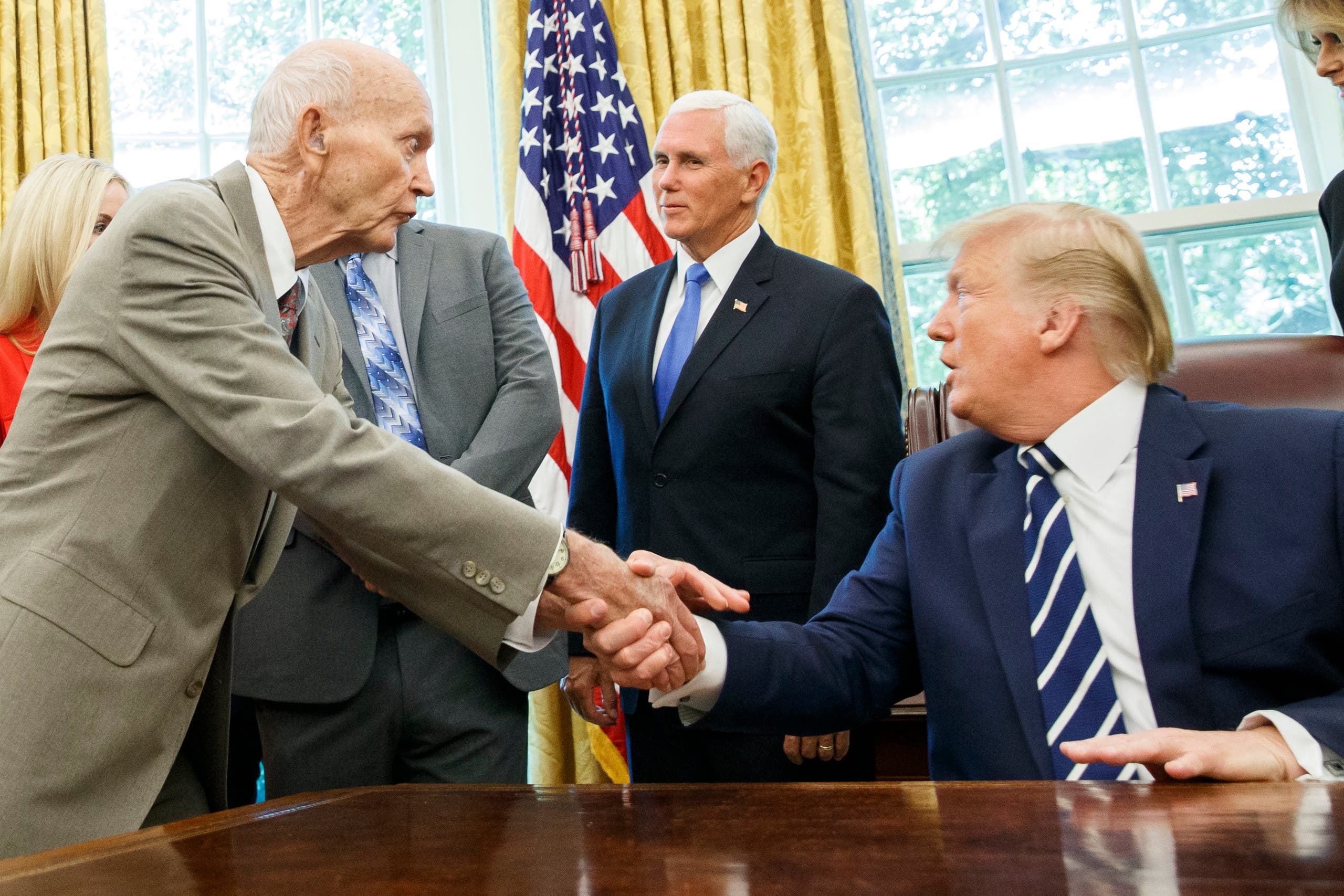 President Donald Trump shakes hands with Apollo 11 astronaut Michael Collin during a photo opportunity commemorating the 50th anniversary of the Apollo 11 moon landing. (AP)