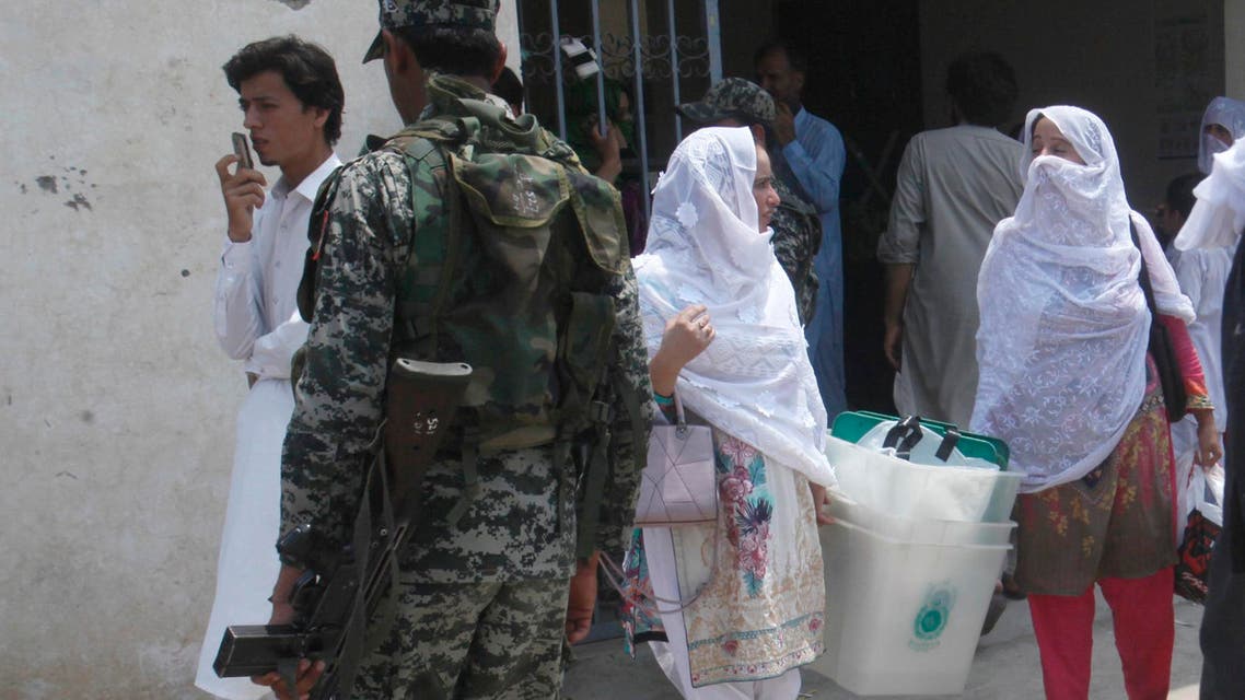 Pakistani election staff carry ballot boxes for elections in Pakistani tribal areas. (AP)