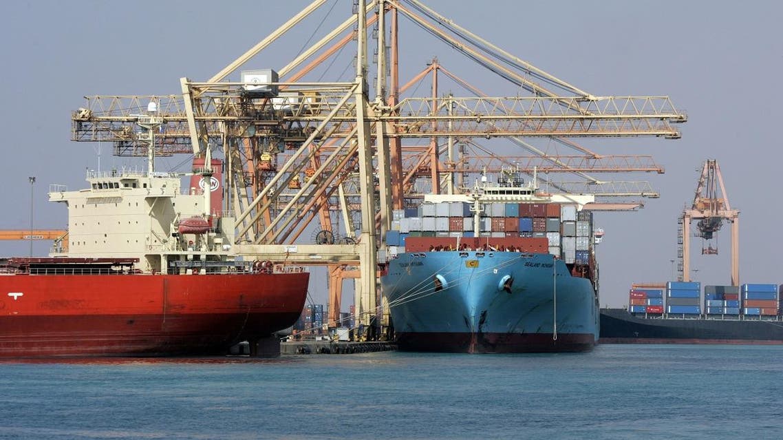 Cranes unload containers from the deck of ships in the Jeddah Islamic Port. (AFP)