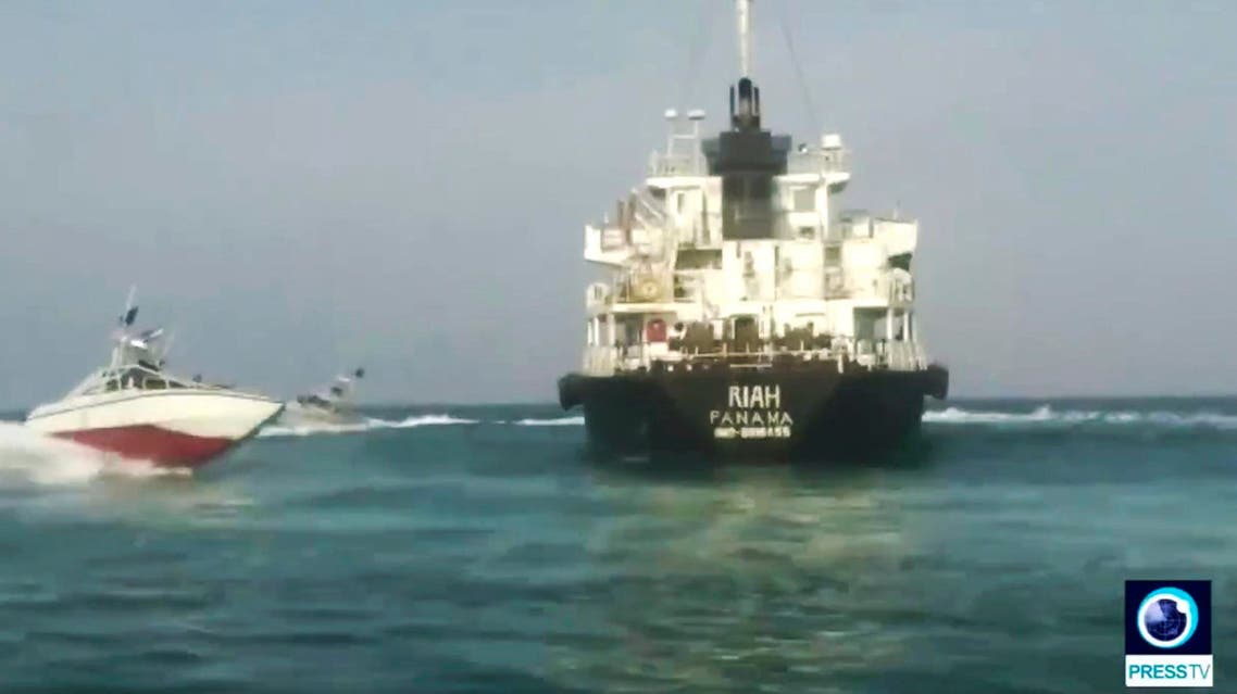 This undated photo provided by Iranian state television's English-language service, Press TV, shows the Panamanian-flagged oil tanker MT Riah surrounded by Iranian Revolutionary Guard vessels. (AP)