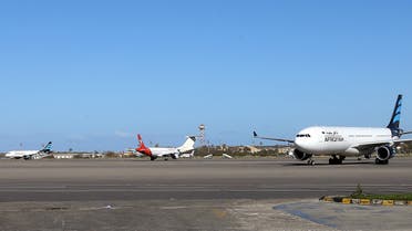 Grounded air-planes sit on the tarmac following an air strike at Mitiga International Airport in the Libyan capital Tripoli on April 8, 2019. A warplane carried out an air strike against the Libyan capital's only functioning airport and halted all flights, aviation authorities said, as fighting raged for control of Tripoli. A security source at Mitiga airport east of the city said no side had yet claimed responsibility for the raid, which hit a runway without causing casualties. There has been heavy fighting near Tripoli since the forces of military strongman Khalifa Haftar launched an assault on Thursday aimed at taking the capital.