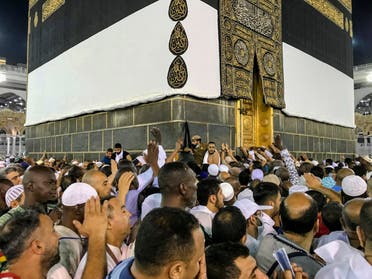 Muslim pilgrims circle the Kaaba (AP)