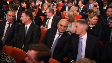 Members of the cabinet: (front row L-R) Britain's Secretary of State for Exiting the European Union (Brexit Minister) Dominic Raab, Britain's Foreign Secretary Jeremy Hunt, Britain's Home Secretary Sajid Javid, Britain's Chancellor of the Exchequer Philip Hammond as they wait for Britain's Prime Minister Theresa May to give her keynote address on the fourth and final day of the Conservative Party Conference 2018 AFP