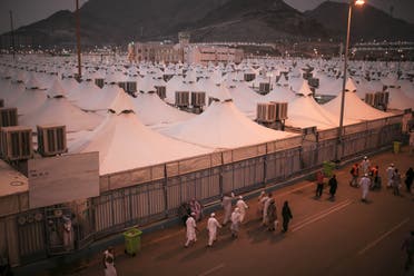 Muslim pilgrims walk past tents in Mina, near the holy city of Mecca, Saudi Arabia. (AP)