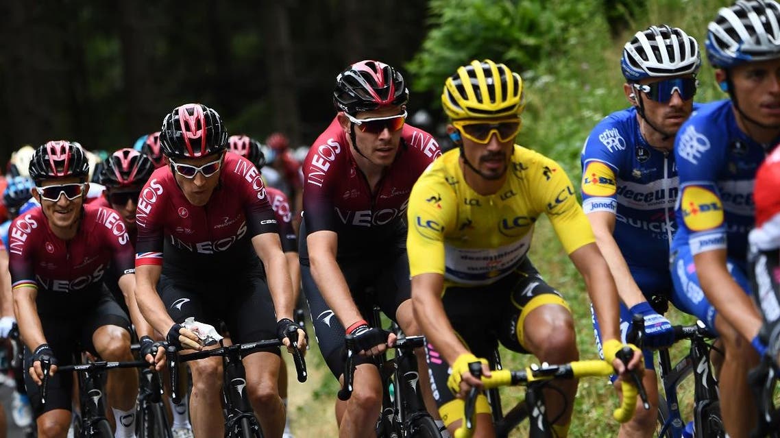 Great Britain's Luke Rowe (C) follows France's Julian Alaphilippe (3rdR), wearing the overall leader's yellow jersey during the sixth stage of the 106th edition of the Tour de France cycling race between Mulhouse and La Planche des Belles Filles, on July 11, 2019. (AFP)
