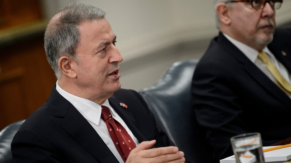 Turkish Defence Minister Hulusi Akar looks on before posing for a family picture during the NATO Defence Ministers meeting in Brussels on June 27, 2019.