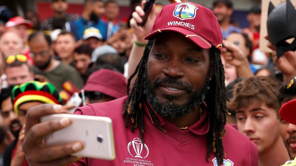 West Indies' Chris Gayle poses for a photo with fans as he celebrates after the match against Afghanistan during the ICC Cricket World Cup at Headingley, Leeds, Britain, on July 4, 2019. (Reuters)