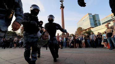 Law enforcement officers detain a participant of a rally calling for opposition candidates to be registered for elections to Moscow City Duma, the capital’s regional parliament, in Moscow. (Reuters)