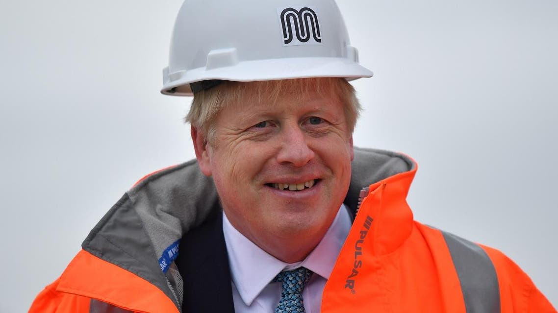 Britain's Prime Minister Boris Johnson reacts as he meets engineering graduates on the site of an under-construction tramline in Stretford, near Manchester, Britain, on July 27, 2019. (Reuters)