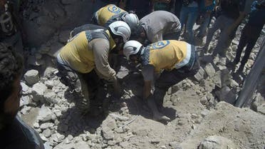Syrian White Helmet civil defense workers pull out a victim from under the rubble of a destroyed building that hit by a Syrian government airstrike. (File photo: AP)