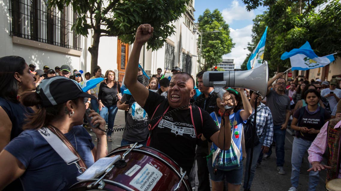 Demonstrators demand the resignation of Guatemalan President Jimmy Morales outside the Presidential House in Guatemala City, Saturday, July 27, 2019. (AP)