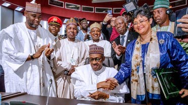 Nigerian President Muhammadu Buhari signs an agreement during African Union summit in Niamey. (File photo: Reuters)