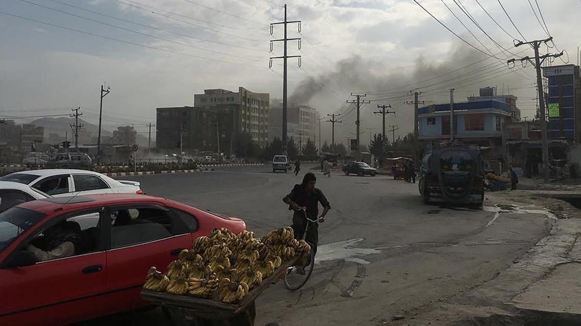 Smoke rises from the site of an attack targeting the Kabul office of the running mate of Afghan President Ashraf Ghani in Kabul. (AFP)