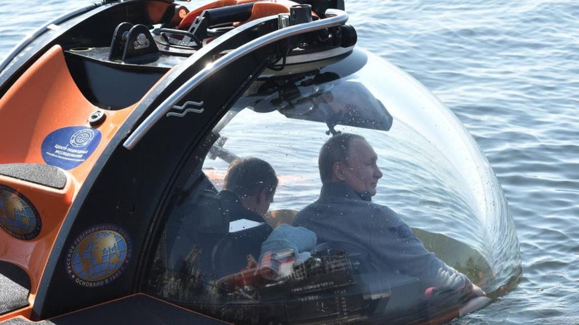 Russia’s President Vladimir Putin submerges aboard a C-Explorer 3 submersible to explore the ShCh-308 submarine. AFP