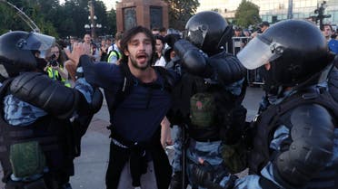 Police officers detain a man during an unsanctioned rally in the center of Moscow, Russia, Saturday, July 27, 2019. (AP)
