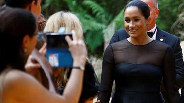 Britain’s Meghan, Duchess of Sussex, poses for pictures as she attends the European premiere of “The Lion King” in London, on July 14, 2019. (Reuters)
