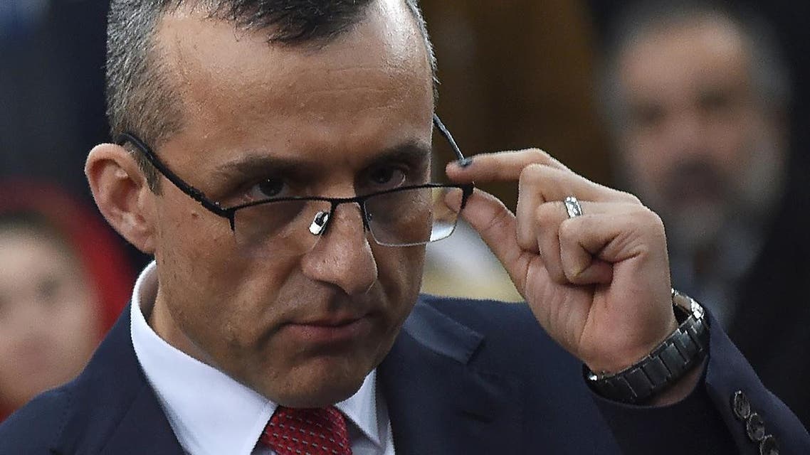 First vice-presidential candidate Amrullah Saleh looks on as he speaks to the media after arriving at the Independent Electoral Commission office in Kabul on January 20, 2019. (AFP)