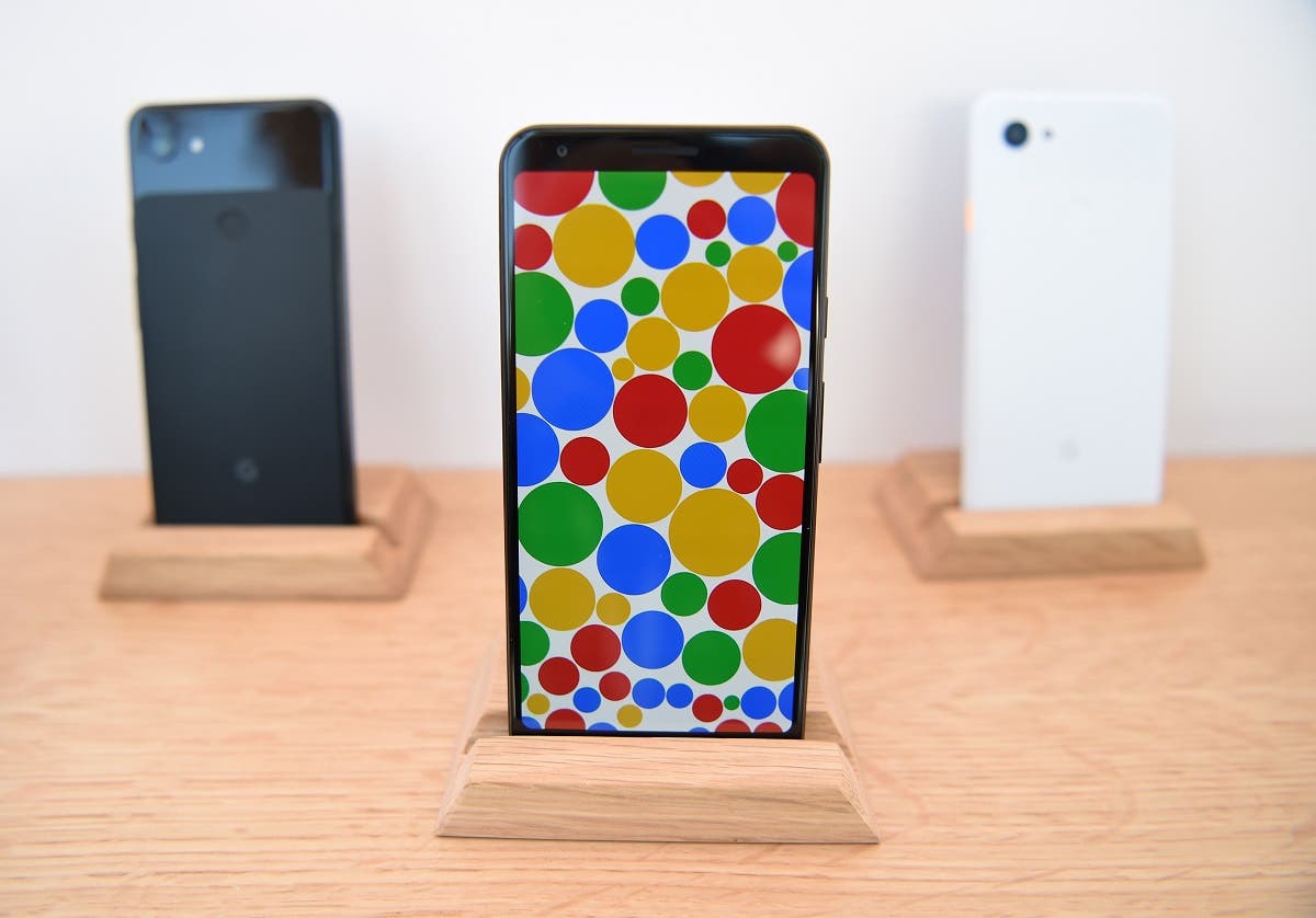 A new Google Pixel 3a phone (C) is displayed during the Google I/O conference at Shoreline Amphitheatre in Mountain View, California on May 7, 2019. (AFP)