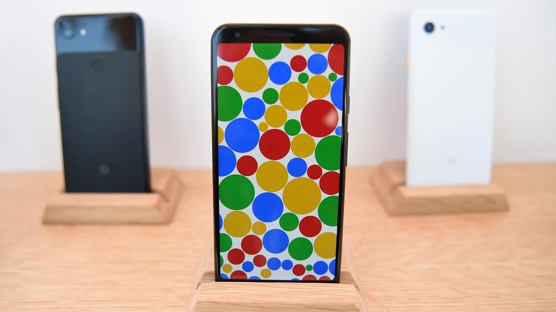 A new Google Pixel 3a phone (C) is displayed during the Google I/O conference at Shoreline Amphitheatre in Mountain View, California on May 7, 2019. (AFP)