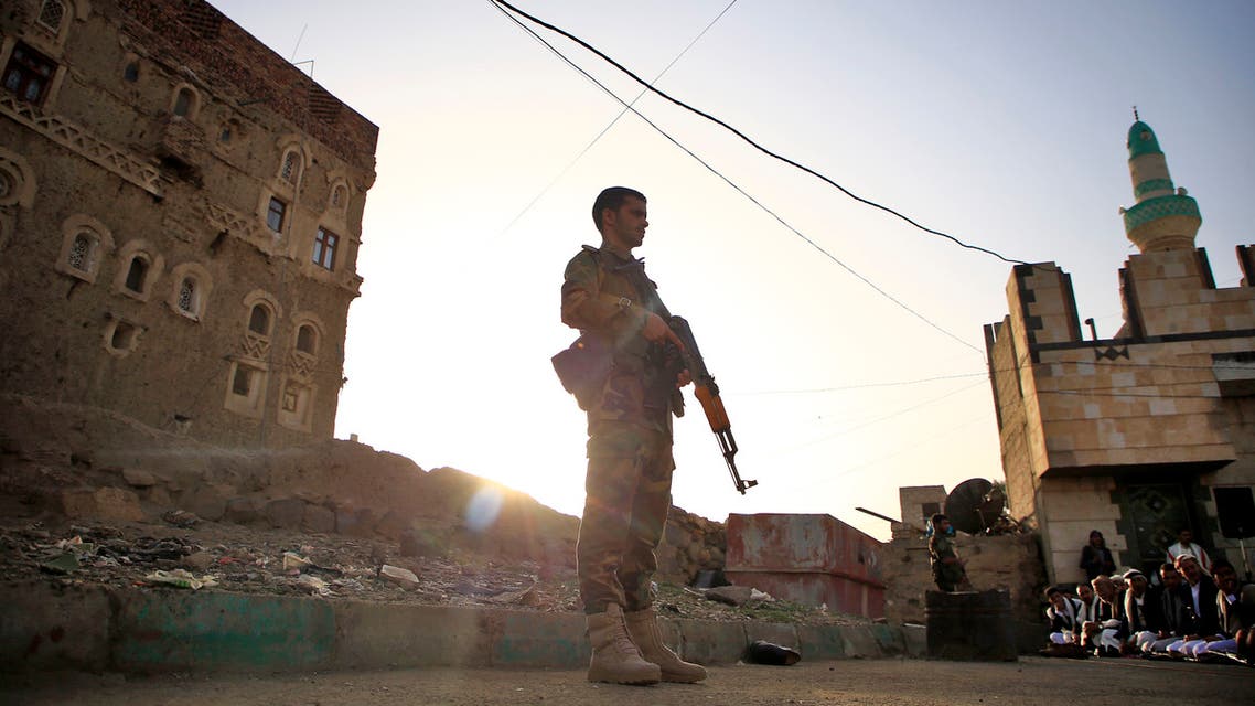 Yemeni security forces loyal to the Huthi-rebel government stands guard as Muslim worshippers perform Eid al-Fitr prayers at a square in the capital Sanaa on June 5, 2019, marking the end of the fasting month of Ramadan.