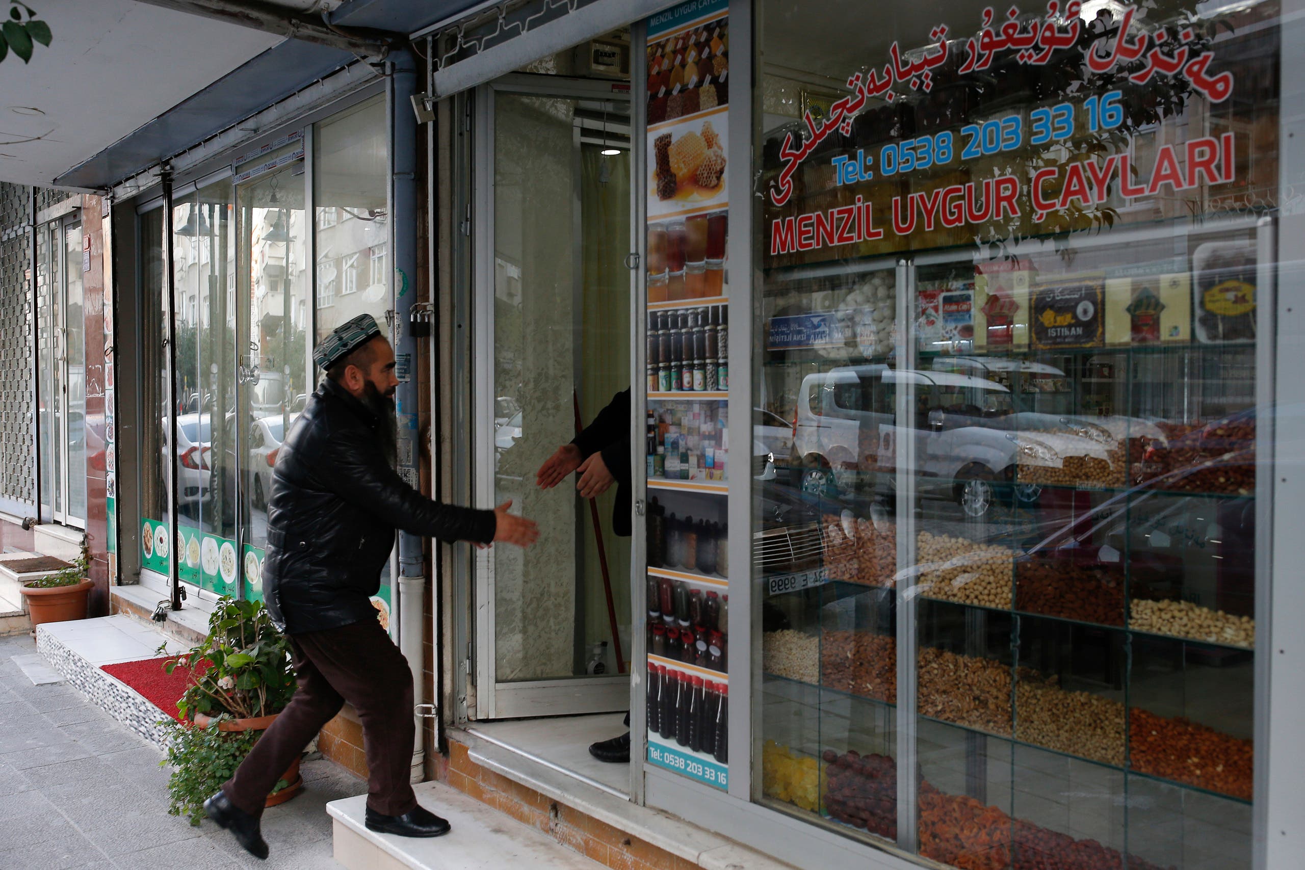 A man enters a halal restaurant in china (AP)