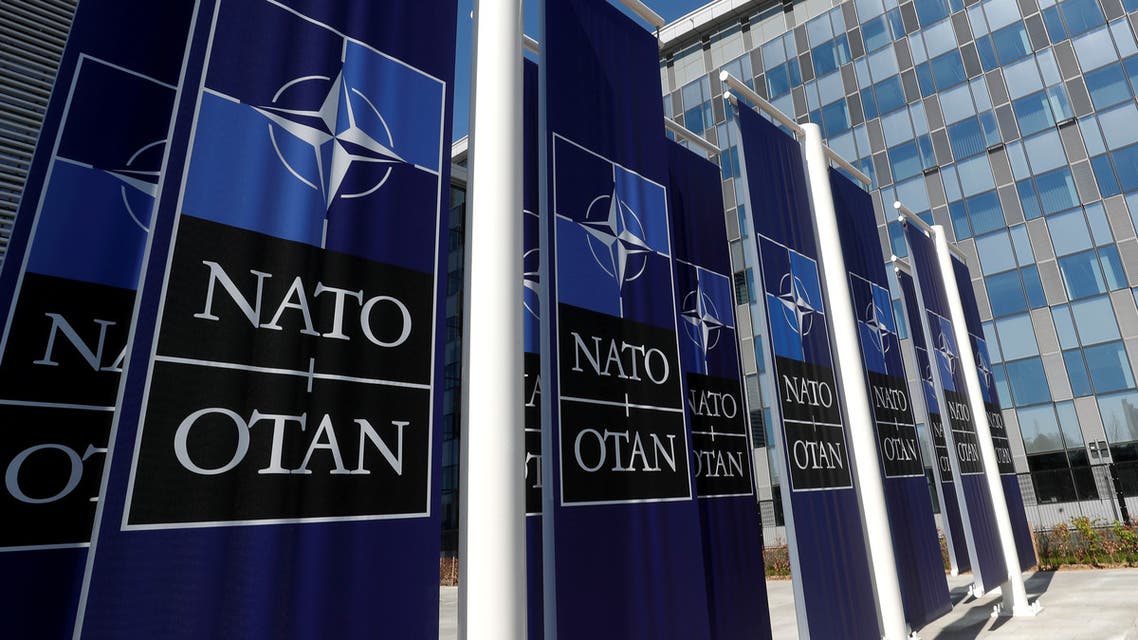 FILE PHOTO: Banners displaying the NATO logo are placed at the entrance of new NATO headquarters during the move to the new building, in Brussels, Belgium April 19, 2018. REUTERS/Yves Herman/File Photo