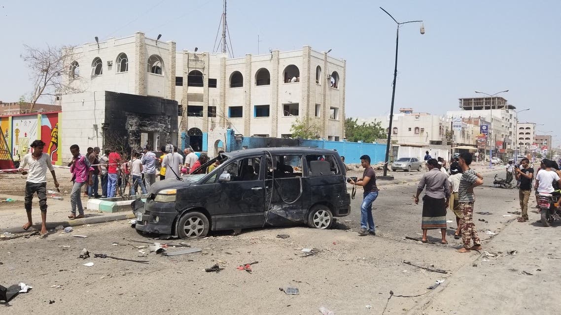 Yemenis walk past a crater at the site of a suicide car bombing on a police station in Sheikh Othman district, in Yemen's government-held second city Aden, on August 1, 2019. Separate attacks by Shiite rebels and a jihadist suicide bomber killed at least 27 people in Yemen's government-held second city Aden, many of them newly trained police cadets, security and medical sources said.