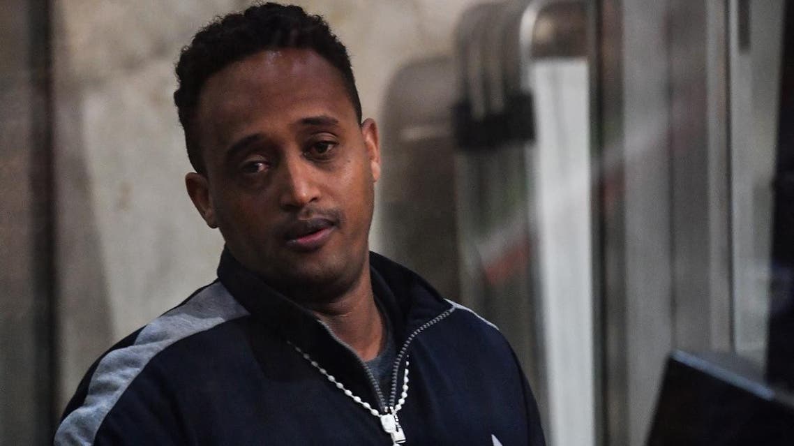 A man believed to be Eritrean Medhanie Yehdego Mered, the head of one of the largest migrant trafficking networks, but claims his identity has been mistaken and to be Medhanie Tesfamariam Behre, is pictured during a session of his trial at the Court of Palermo in Sicily on February 14, 2019. (AFP)