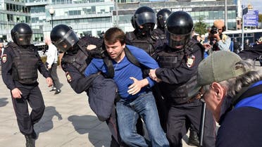 Police officers detain a man during an unsanctioned rally urging fair elections in downtown Moscow on August 3, 2019. (AFP)