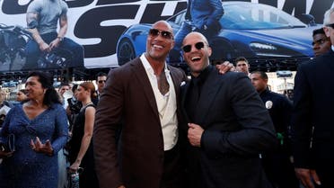 Cast members Dwayne Johnson and Jason Statham arrive at the premiere for "Fast & Furious Presents: Hobbs & Shaw" in Los Angeles. (Reuters)