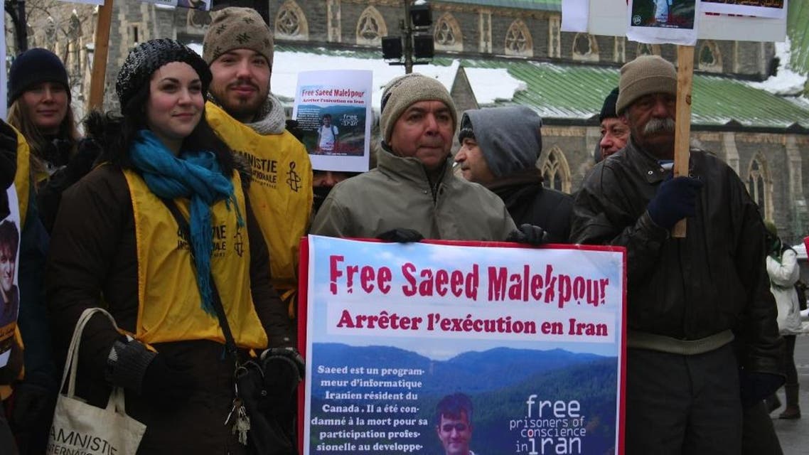 This January 22, 2012 photo shows supporters demonstrating for the release of Saeed Malekpour, in Phillips Square in Montreal, Quebec, Canada. AFP