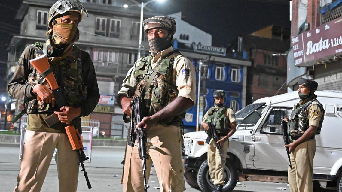 Indian paramilitary troopers stand guard at a roadblock at Maisuma locality in Srinagar on August 4, 2019. (AFP)