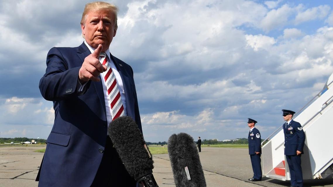 US President Donald Trump gives a statement about the recent mass shootings in El Paso and Dayton before boarding to Washington at Morristown Airport on August 4, 2019. (AFP)