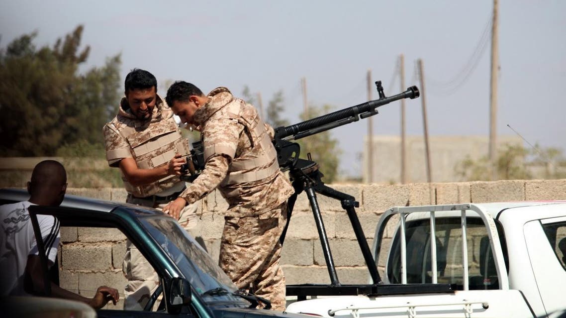 Soldiers from the Libyan National Army get ready to enter Rafallah al-sahati Islamic Militia Brigades compound, one of the compound buildings can be seen behind the wall, in Benghazi, Libya. (Reuters)
