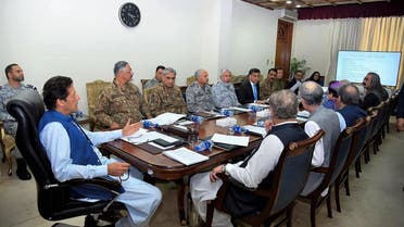 Pakistan's Prime Minister Imran Khan (L) chairs a National Security Committee meeting along with armed forces chiefs and other government officials in Islamabad on August 7, 2019. (AFP)