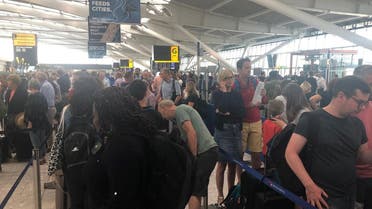 Passengers wait in long queues at Heathrow Airport as IT problems caused flight delays in London, Britain, on August 7, 2019, in this picture obtained from social media. (Reuters)