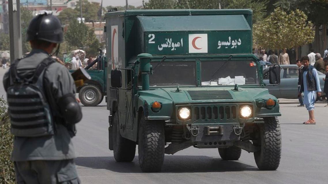 An Afghan military ambulance rushes towards the site of an explosion near police headquarters in Kabul, Afghanistan. (AP)