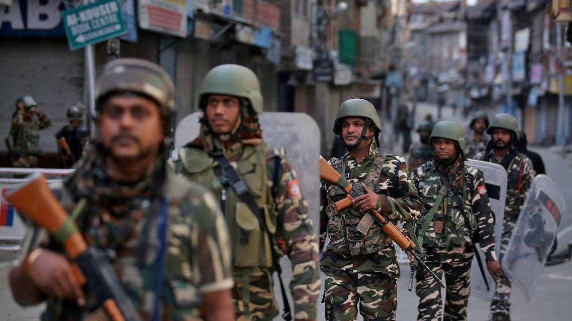 Indian security forces personnel patrol a deserted street during restrictions after the government scrapped special status for Kashmir, in Srinagar, on August 9, 2019. (Reuters)