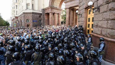 Protesters confront riot police during an unauthorised rally demanding independent and opposition candidates be allowed to run for office in local election in September, in downtown Moscow on July 27, 2019. (AFP)