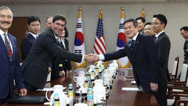 US Secretary of Defense Mark Esper (centre L) shakes hands with South Korea's Defense Minister Jeong Kyeong-doo (centre R) during their meeting at the Defense Ministry in Seoul on August 9, 2019. (AFP)