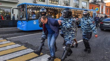 Servicemen of the Russian special police forces detain a man after a rally urging fair elections in central Moscow on August 10, 2019. (AFP)