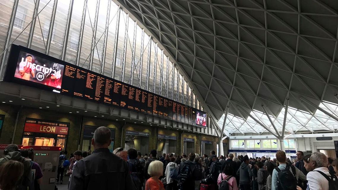 People wait for trains at King's Cross station in London Saturday, Aug. 10, 2019 a day after all services in and out of the station were suspended when a power cut caused major disruption across the country. (AP)