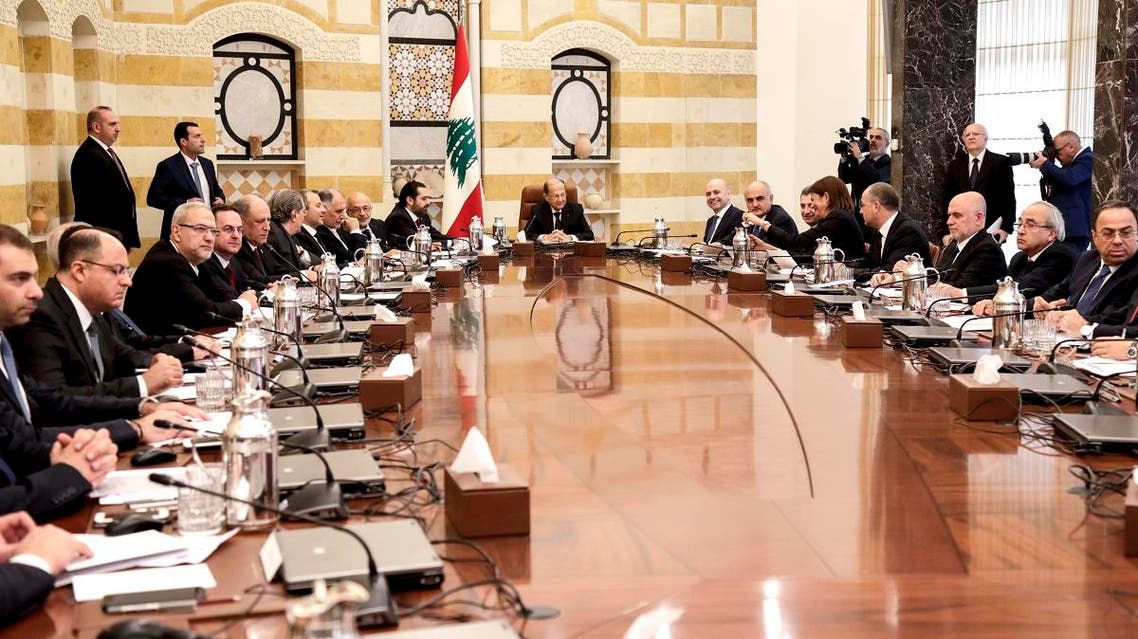 Lebanese President Michel Aoun (C) chairs the new government's first cabinet meeting, accompanied by Prime Minister Saad Hariri (C-L), at the presidential palace in Baabda, east of the capital Beirut on February 2, 2019. (AFP)