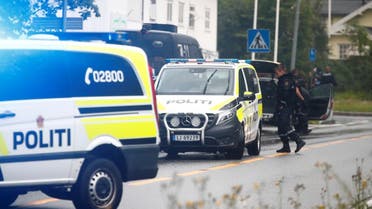 A picture taken on August 10, 2019 shows police vehicles near the al-Noor islamic center mosque where a gunman, armed with multiple weapons, went on a shooting spree in the town of Baerum, an Oslo suburb. (AFP)