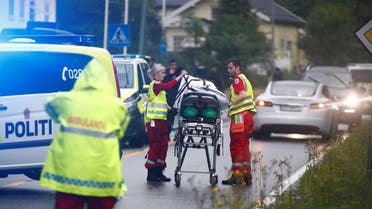 Medics with a stretcher near the al-Noor islamic center mosque where a gunman, armed with multiple weapons, went on a shooting spree in the town of Baerum, an Oslo suburb. (AFP)