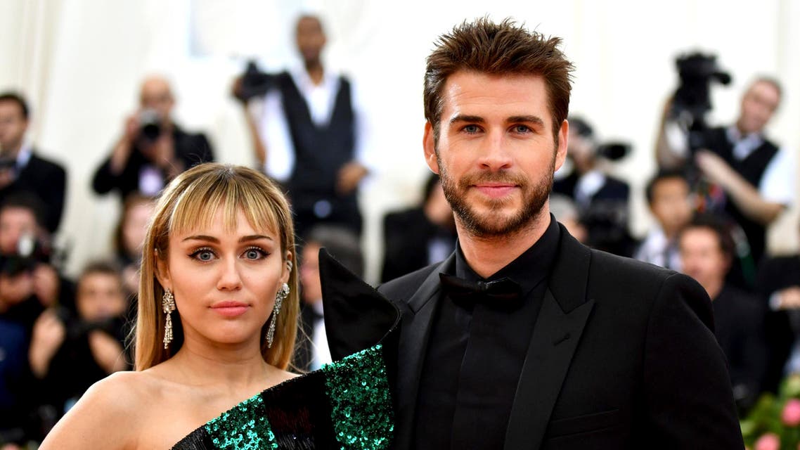 miley cyrus and liam hemsworth (AP)