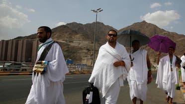 Yemeni Pilgrims walk Friday, Aug. 9, 2019, at the huge tent city of Mina, in Mecca, Saudi Arabia, where pilgrims will spend the night before heading to Arafat Saturday for the main day of the annual Hajj pilgrimage. (AP)